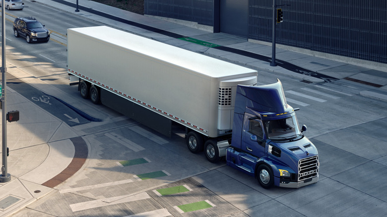 Mack Anthem crossing an urban intersection