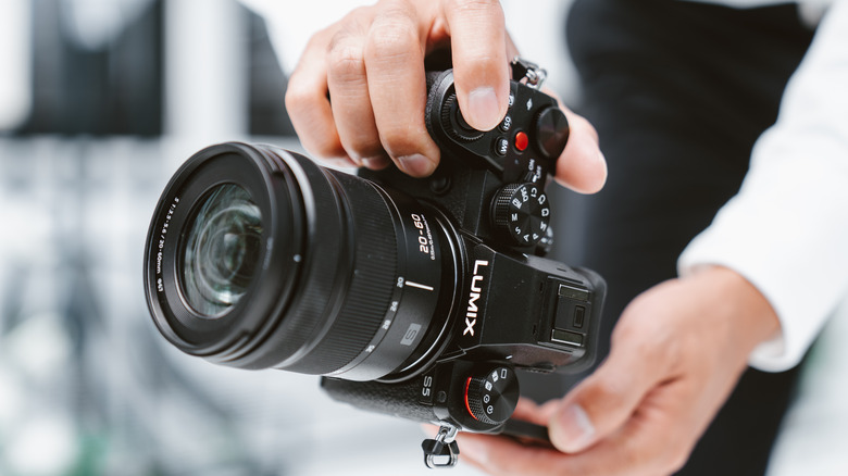 Person holding Lumix camera