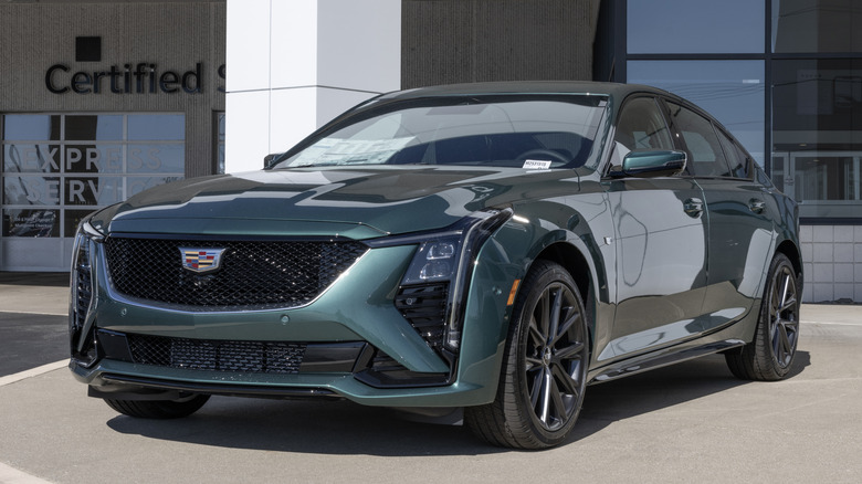 A green Cadillac CT5 parked