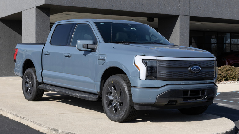 A blue Ford F-150 Lighting parked