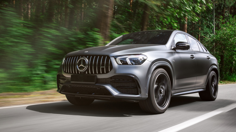 A gray Mercedes-Benz GLE driving