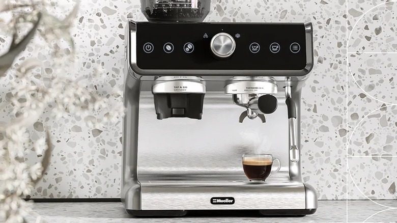 Espresso machine pouring coffee