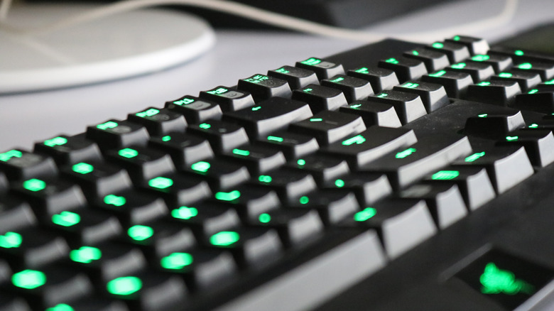 A Razer keyboard with green lights