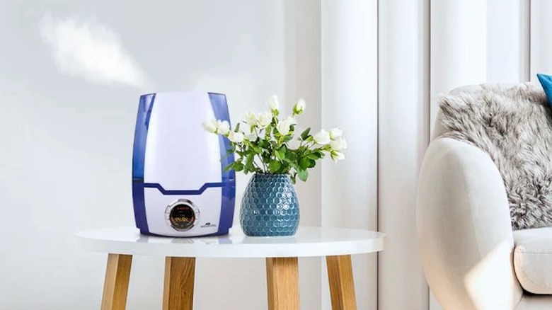 MH-505A Ultrasonic Cool Mist Humidifier misting from an end table.