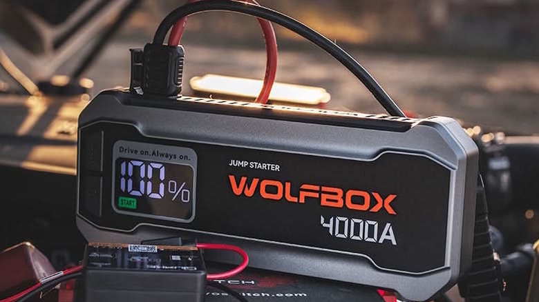 jumper box resting on a car battery