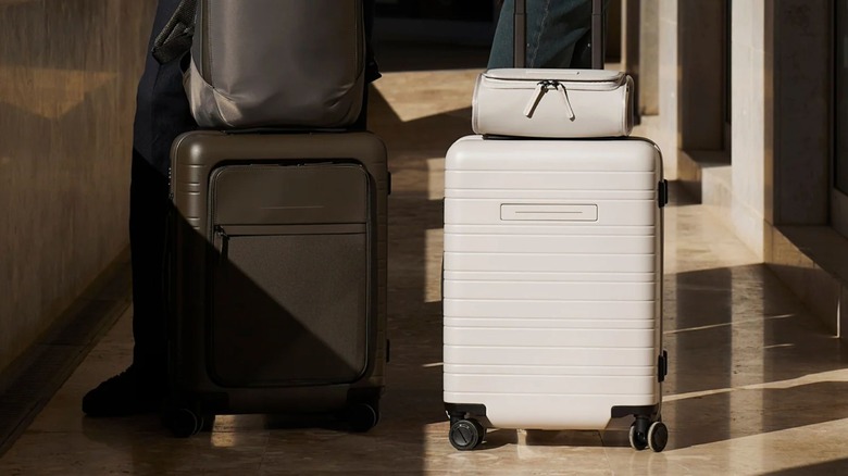 Brown and white Horizn Studios suitcases next to each other