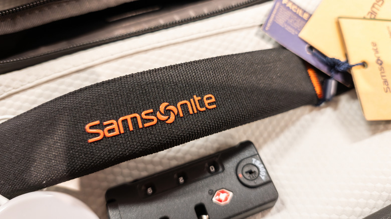 Closeup of a black Samsonite suitcase handle