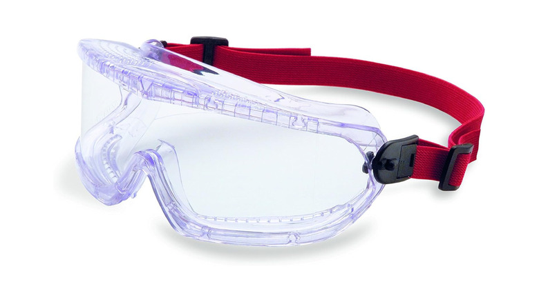 A pair of transparent safety goggles by Uvex