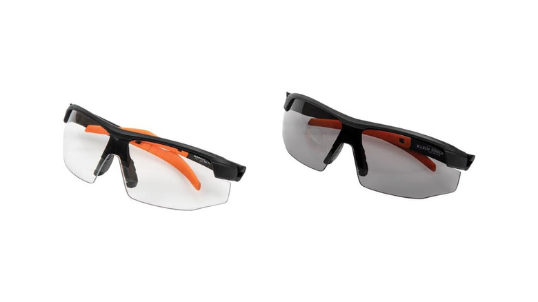 Two pairs of safety glasses in the black and orange brand colors of Klein Tools