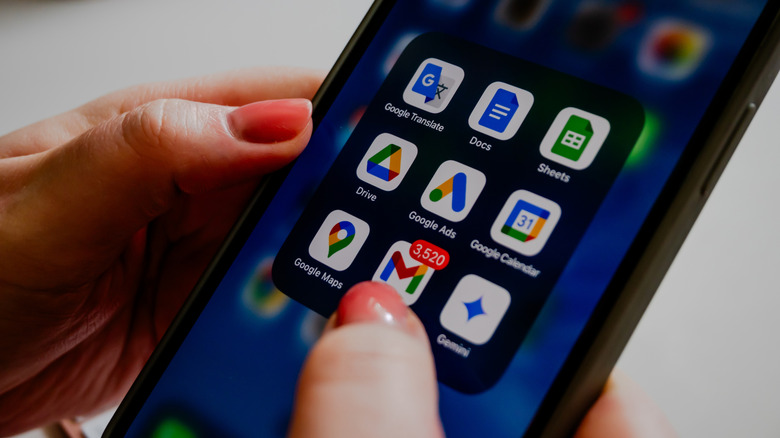 Hands using Google email app