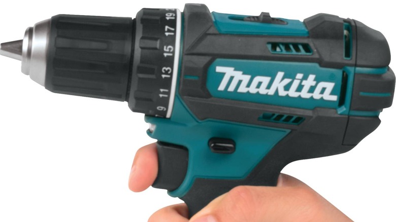 Makita drill in person's hand