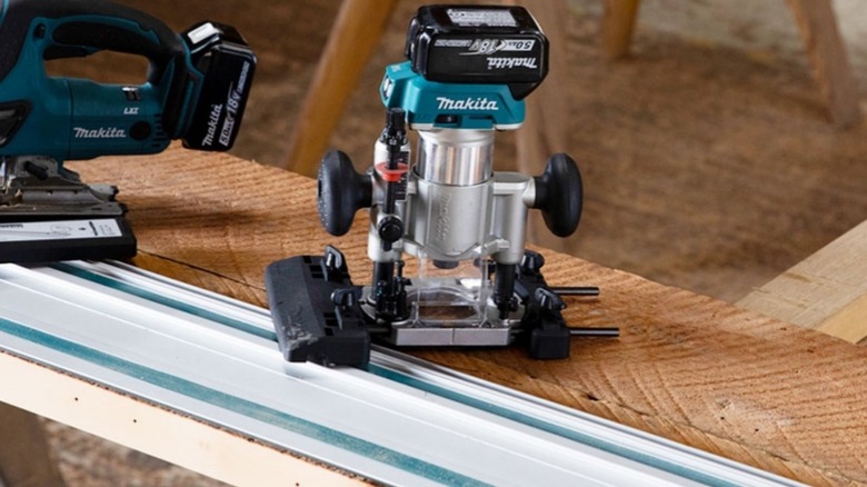 Makita router next to a guide rail