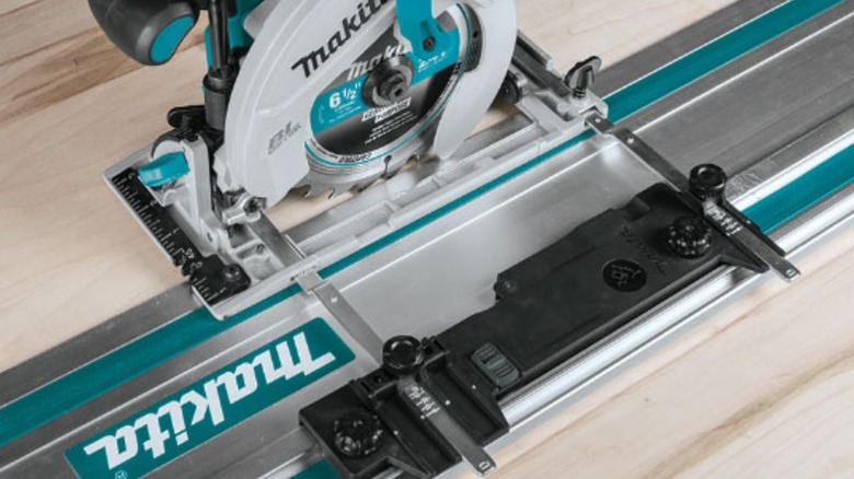 Makita circular saw on guide rail with adaptor