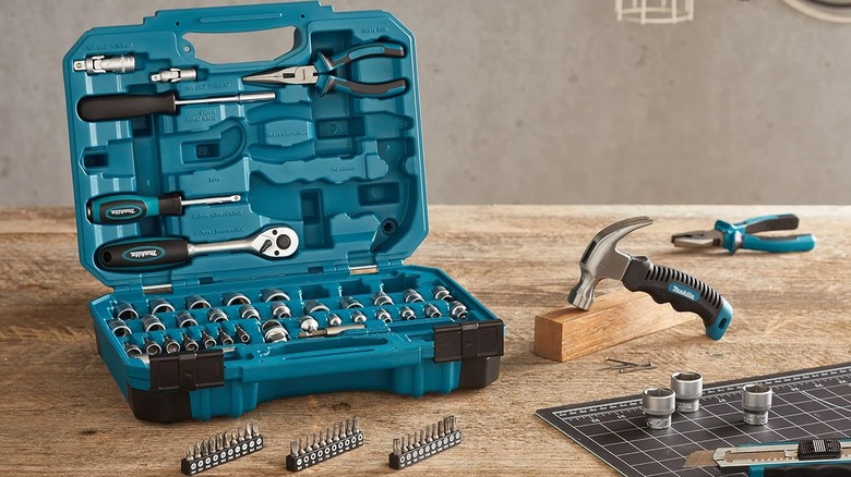 Makita hand tools in carry box on a workbench
