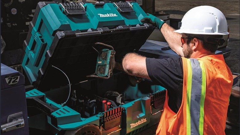 Construction worker using Makita MakTrak storage