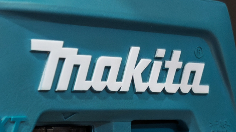 The Makita logo on the side of a tool.