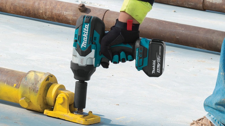 Makita 18V LXT High-Torque ½-inch Impact Wrench in use