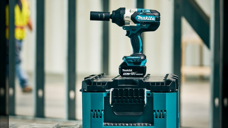 Makita 18V LXT High-Torque ½-inch Impact Wrench upright on a tool case