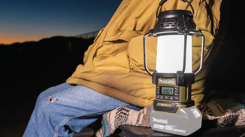Makita lantern next to person