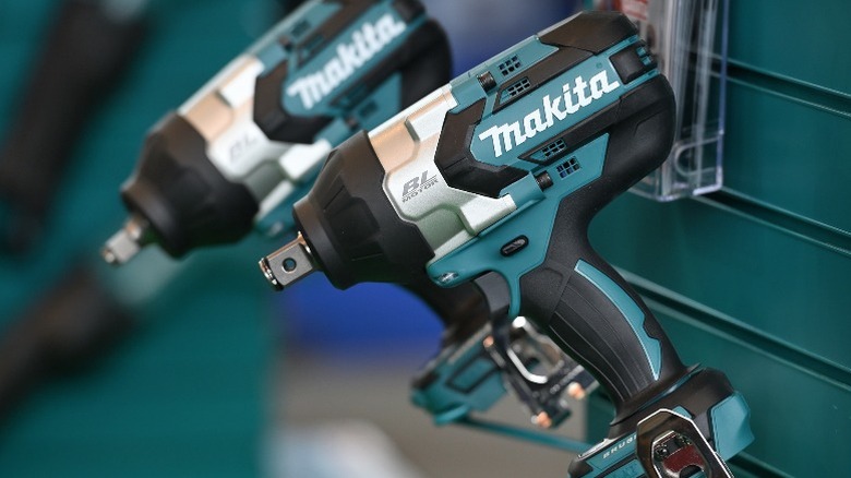 Makita drills hanging on side of toolbox