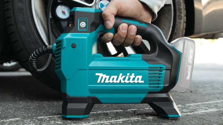 Tire inflator attached to tire and pumping air