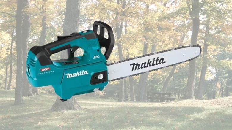 Makita 16-inch top handle chainsaw against wood background