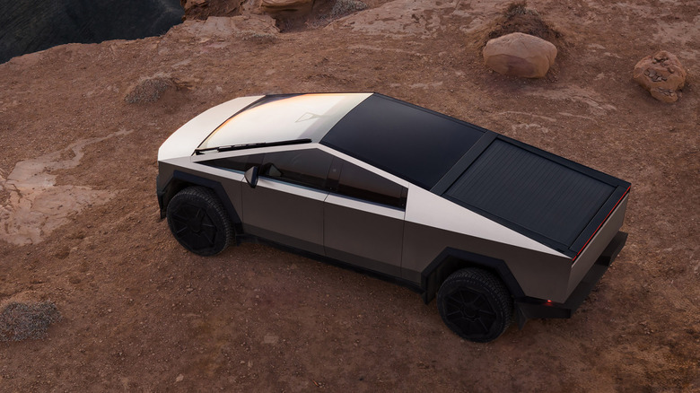 Overhead view of Tesla Cybertruck parked in desert canyon.