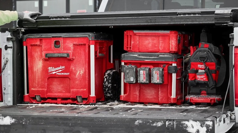 The Milwaukee Tool Packout Rolling Drawer Tool Box fits underneath a pickup truck tonneau cover without modification.