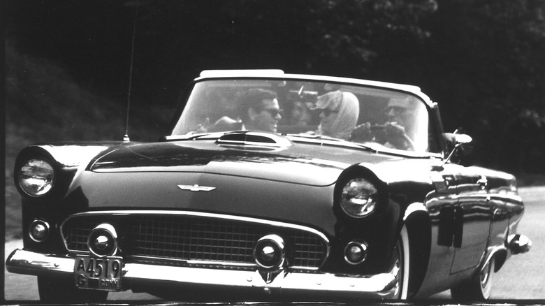 Arthur Miller and Marilyn Monroe driving in a 1956 Ford Thunderbird