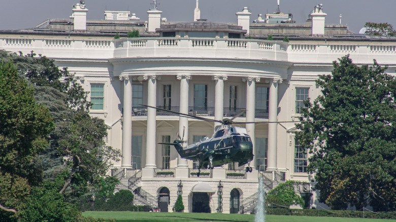 The White House in Washington DC with Marine One helicopter taking off