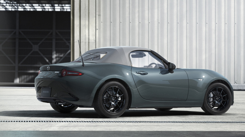 Rear 3/4 view of 2027 Mazda MX-5 Miata in Zinc Green Metallic.