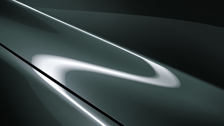 Close up view of Mazda Zinc Green Metallic color under studio lights.