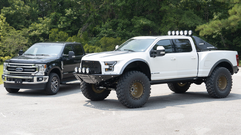 MegaRexx MegaRaptor parked next to a stock Ford F-250 Super Duty