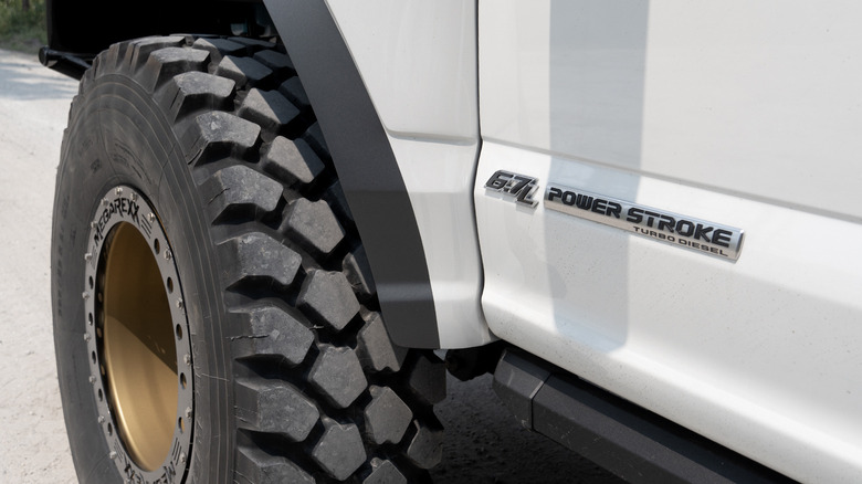 MegaRexx MegaRaptor 6.7L Power Stroke badge and front tire