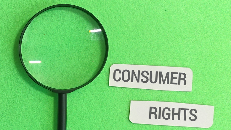 A bright green background with a black magnifying glass and the words consumer rights printed in black block letters on white