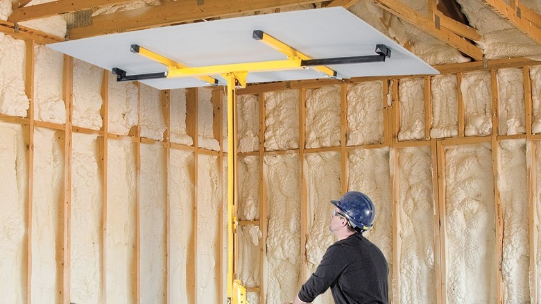 person operating MetalTech drywall lift
