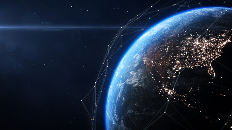 Earth seen from space with a rendering of the satellite system