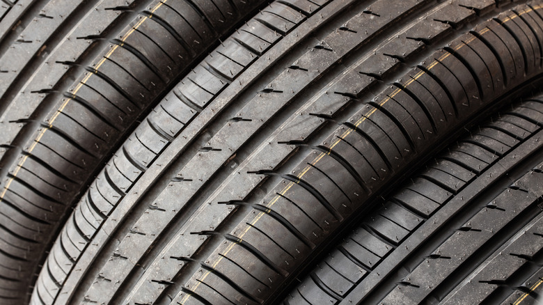 Close-up of tires side-by-side, showing tread pattern.