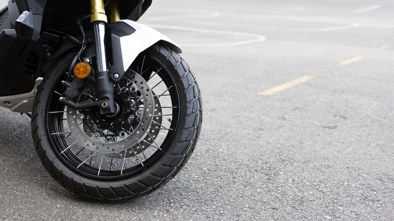 A close-up of the tire on an unidentified motorcycle
