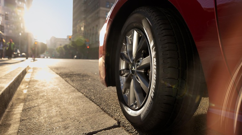 Michelin Defender2 tire on Toyota Camry in urban setting