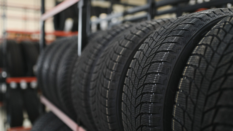 New car tire is placed on the tire storage rack in the tire factory.