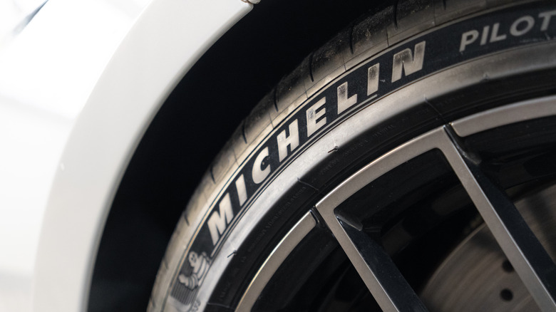 close-up of Michelin logo on a tire on a white vehicle
