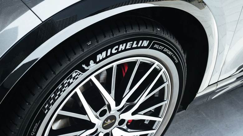 Close up view of Michelin Pilot Sport 5 Energy tire on electric SUV.