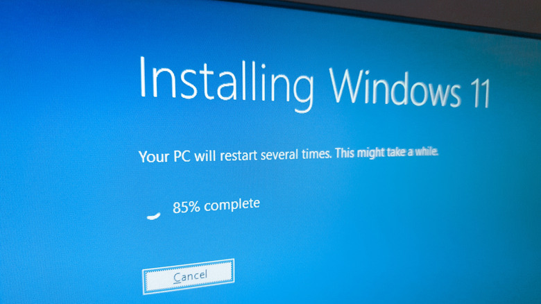 A close-up of a monitor displaying a later point in the Windows 11 installation
