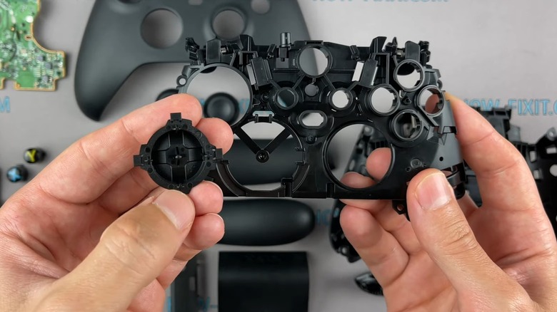 A person taking apart an Xbox Series X controller.