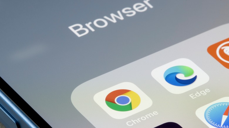 Phone displaying Chrome and Edge icons