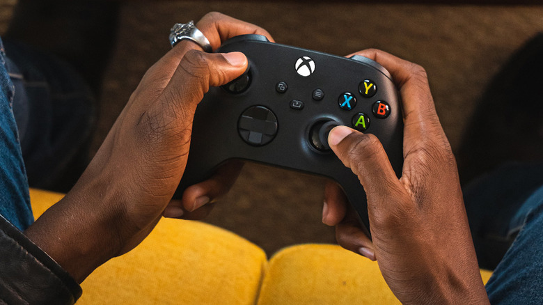Person holding a Xbox Wireless Controller