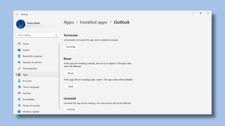Screenshot of Windows settings showing options to repair, reset, and uninstall Outlook