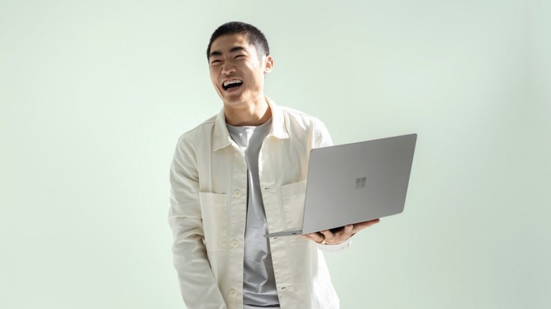 Man holding Surface Laptop Go 2