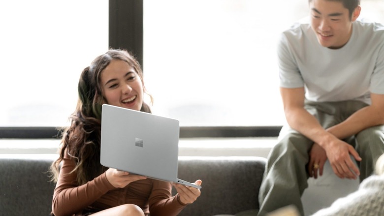 Woman holding Microsoft Surface Laptop Go 2